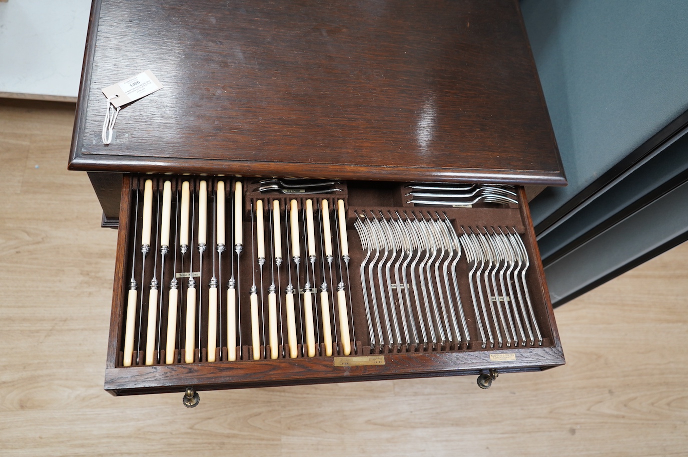 A Mappin and Webb oak Jacobean style canteen of plated flatware, complete contents, containing twelve settings, etc. Condition - fair to good